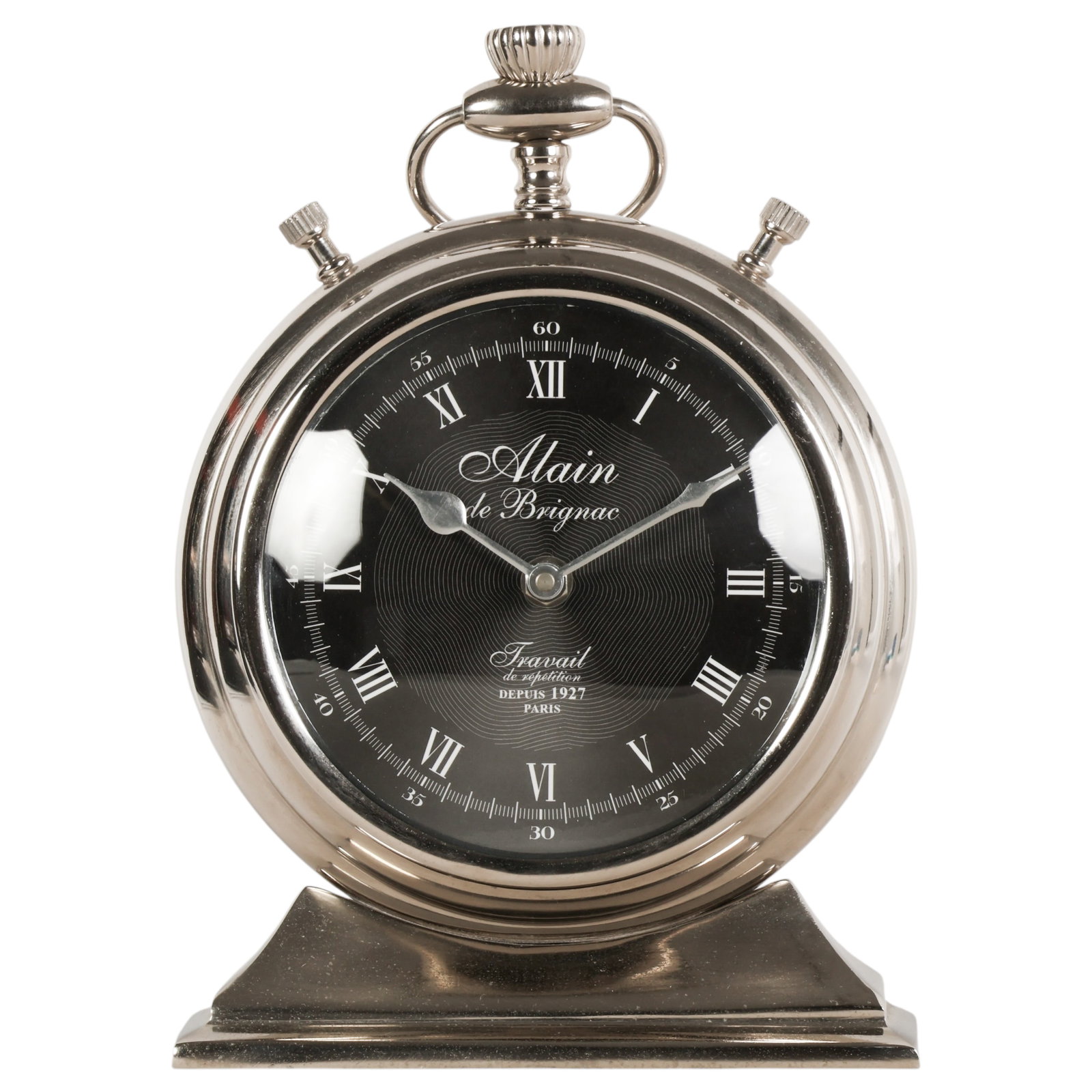 Eichholtz Alain de Brignac Pocket Watch Type Clock: Eichholtz Alain de Brignac pocket watch-style mantel clock featuring a polished silver-tone case designed in the form of an oversized pocket watch, with top loop and stepped pedestal base. The dial di