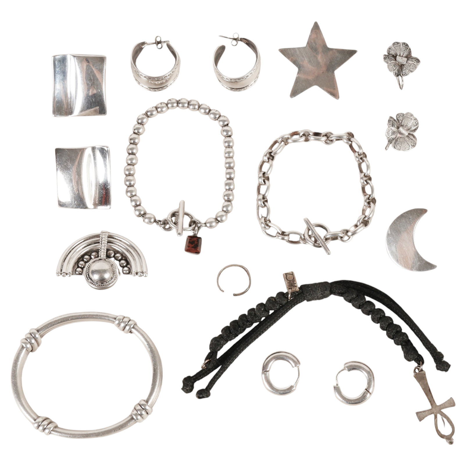 Sterling Silver Earrings and Bracelets ESTATE LOT: Collection of sterling silver jewelry and accessory items comprising five pairs of earrings, including filigree floral, crescent moon and star, simple hoop, and modernist square designs; one decorativ