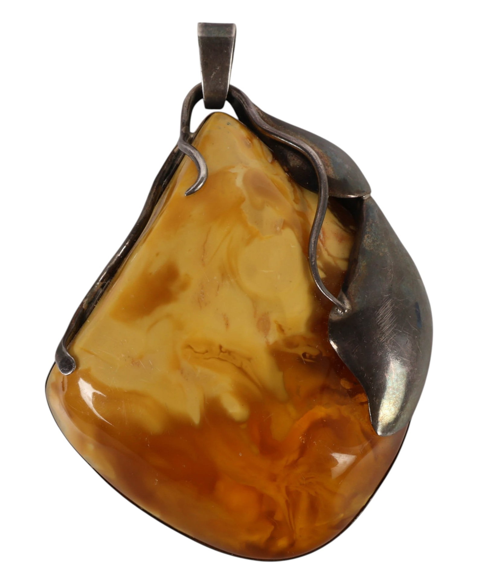 Sterling Silver Butterscotch Amber Pendant 103g: Sterling silver and butterscotch Baltic amber pendant featuring a large free-form stone measuring approximately 71 x 88 x 24 mm, set in an organic mount with leaf and vine motifs. Bail marked "925 WA.