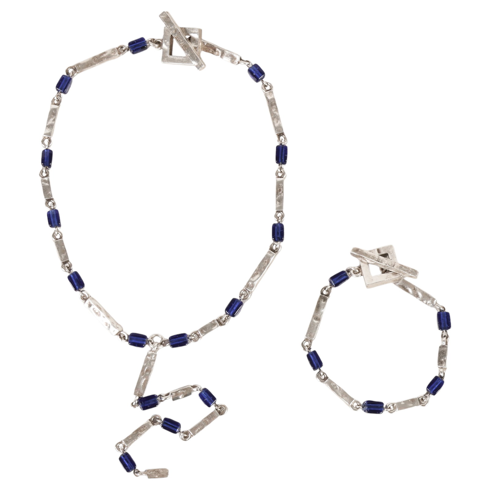 Biche De Bere French Designer Necklace & Bracelet: Biche de Bere, French designer jewelry set comprising a silver-tone necklace and coordinating bracelet, each formed with hammered rectangular links alternating with deep cobalt blue lucite beads and