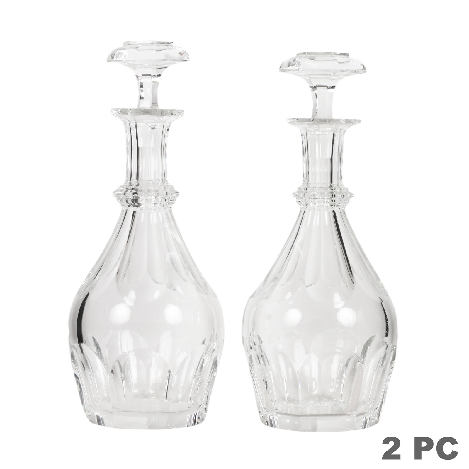 Baccarat French Pair of Crystal Harcourt Decanters: Baccarat pair of French clear crystal decanters in the iconic Harcourt pattern, each featuring a faceted body with deep architectural cuts, elongated cut neck, stepped collar, and matching faceted cry