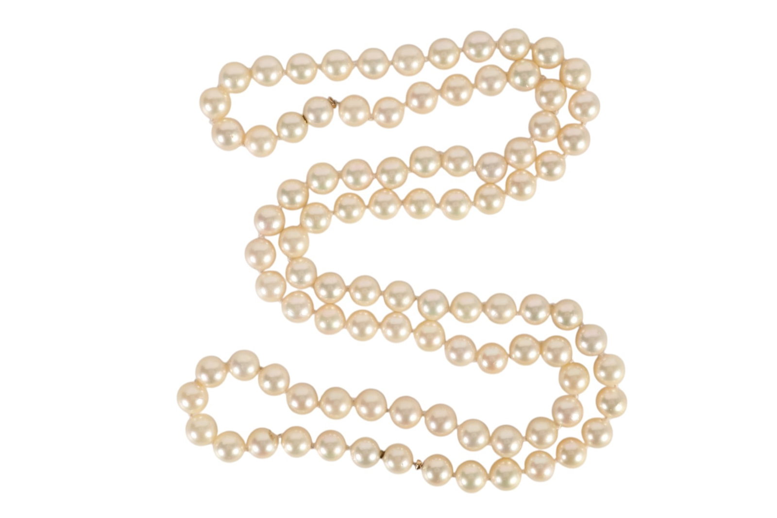 Classic Hand Knotted Cultured Akoya Pearl Necklace: Classic Cultured Akoya Pearl Necklace, composed of a single strand of individually knotted, near-round white cultured pearls displaying high luster with soft rose and cream overtones. The pearls measu