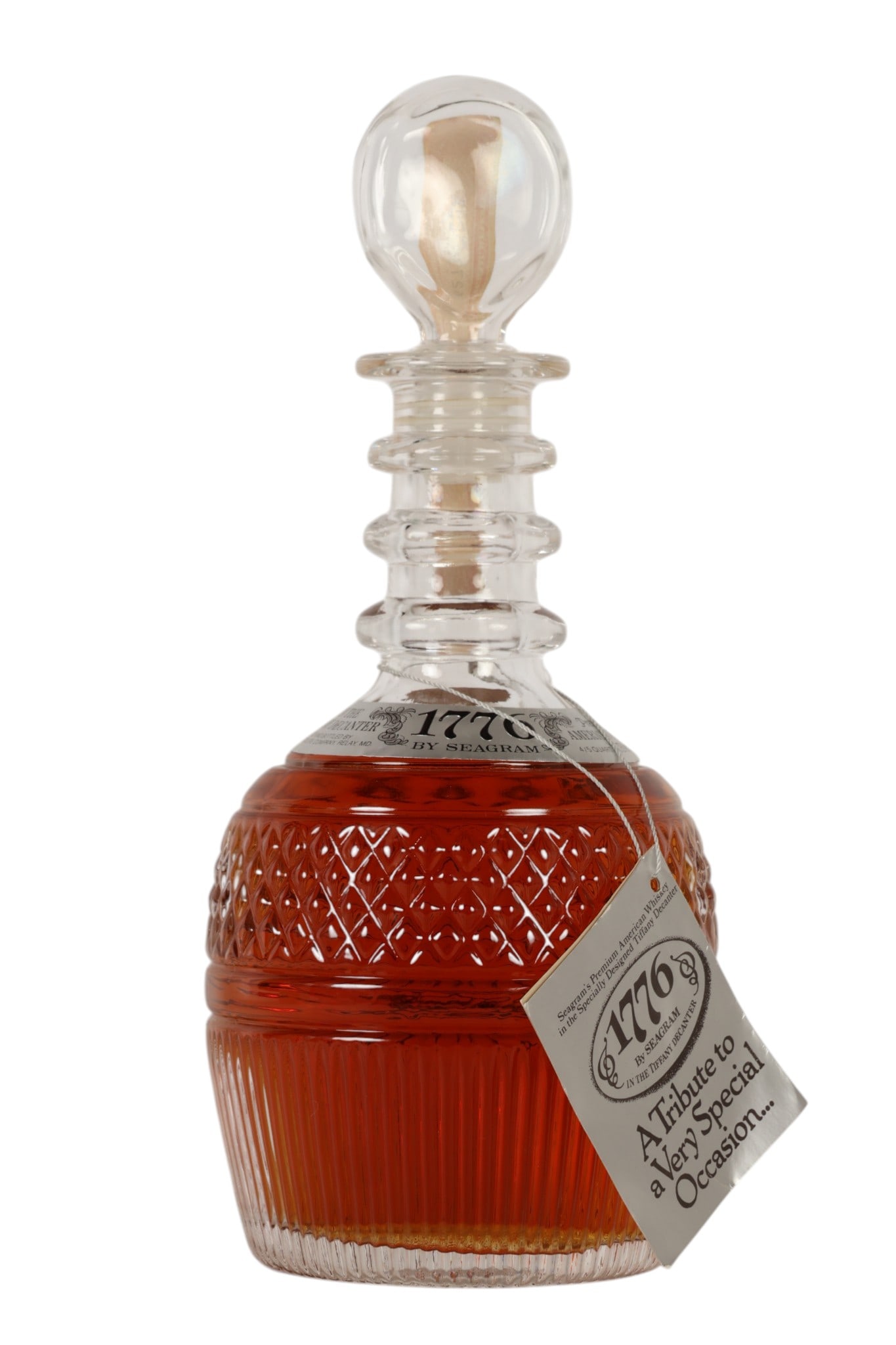 Seagram 1776 Tiffany & Co Whiskey Decanter w/ Box: Limited edition 1776 by Seagram premium American whiskey presented in a specially designed Tiffany & Co. crystal decanter. Issued in celebration of Americas Bicentennial. The faceted glass body featur