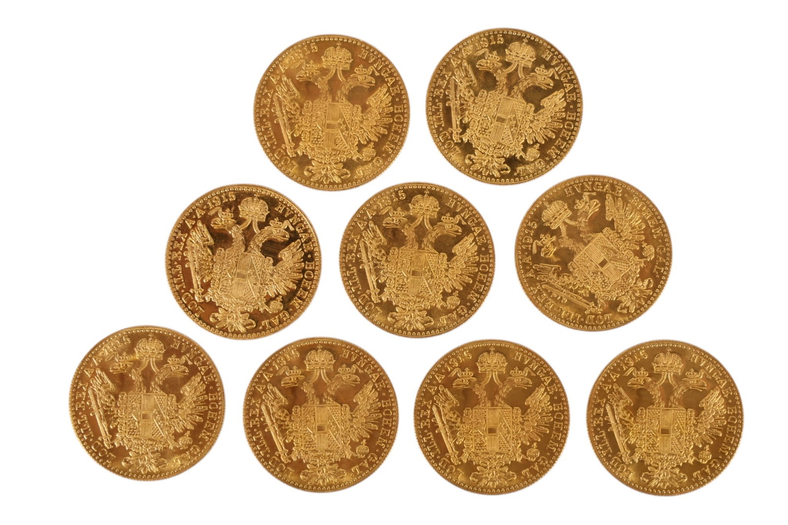 1915 Austrian Gold Ducats Coins 9pc LOT 31.44 gr.: Collection of nine gold ducat coins featuring Emperor Franz Joseph I, dated 1915 restrikes as commonly issued by the Austrian Mint. Each coin bears the portrait of Franz Joseph I with corresponding im