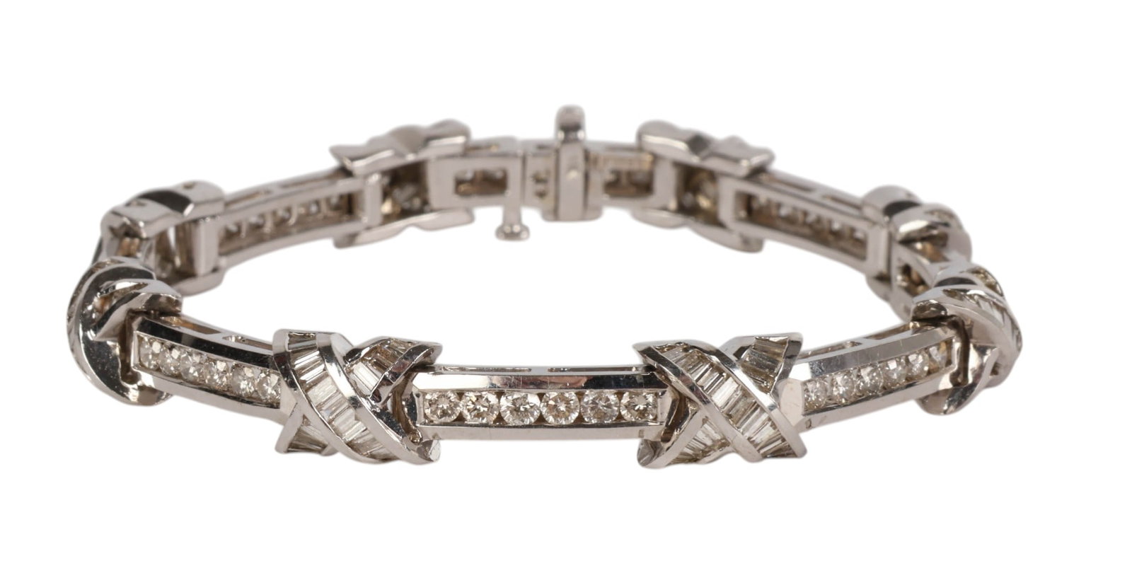 14k Gold 2 CTTW Diamond X Tennis Bracelet 25g: 14K white gold, a diamond link tennis bracelet featuring alternating X motif links and bar links set with round and baguette cut diamonds in channel and prong settings. Secured with a box clasp closur