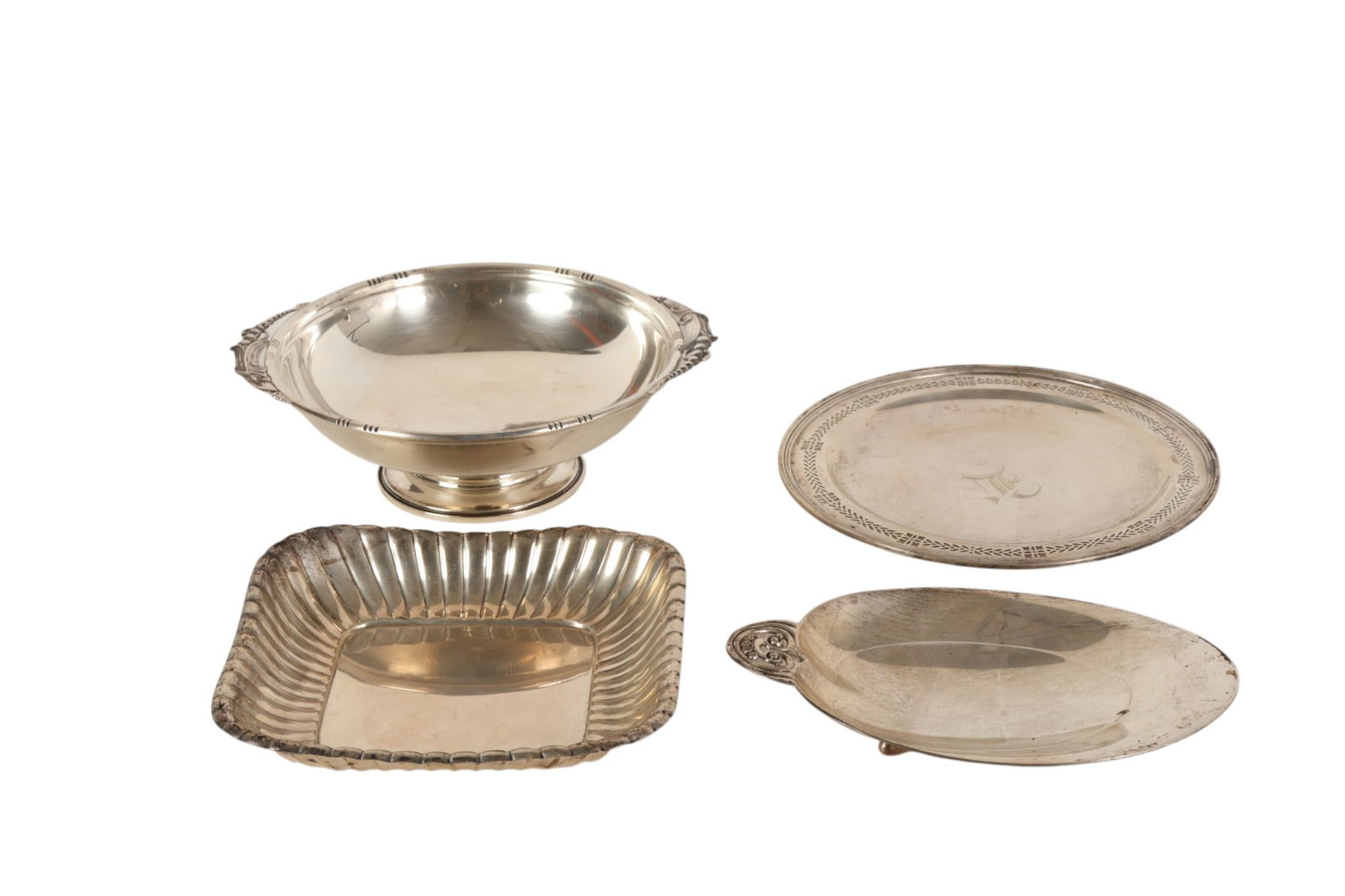 Sterling Tiffany & Co Trays & More 4pc LOT 1910g: Four piece lot of sterling silver table articles, comprising a circular footed bowl with side handles and a rectangular dish with fluted sides, both marked Sterling, together with a footed oval dish w