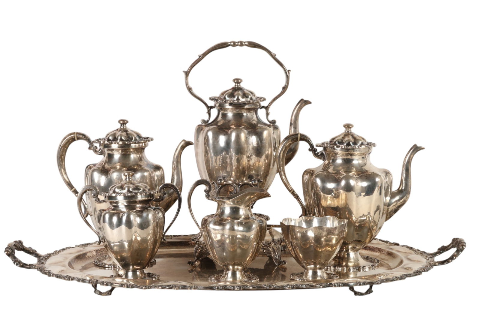 Mexican Sterling Silver 7pc Coffee Tea SET 9,980: Seven piece Mexican sterling silver tea and coffee service, comprising a large handled tray, tall coffee pot, teapot, hot water pot with frame and burner, covered sugar bowl, creamer, and small footed