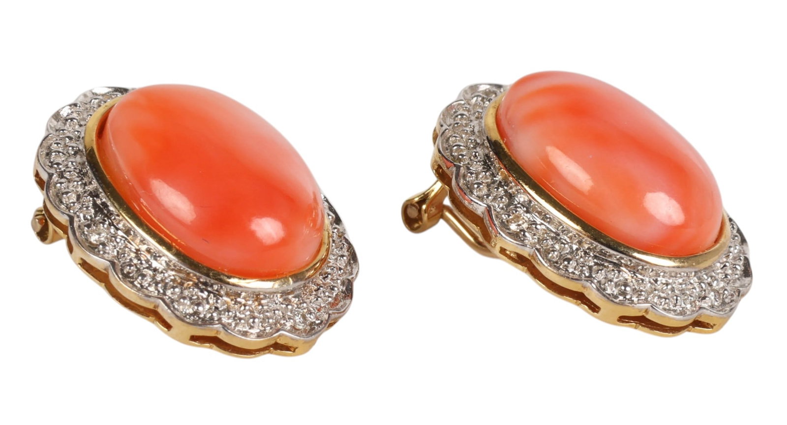 14K Angel Skin Coral Diamond Halo Earrings PAIR: 14K yellow gold, a pair of angel skin coral and diamond earrings each set with an oval coral cabochon measuring approximately 14 x 10 mm framed by a halo of round diamonds. Mounted in 14K yellow gold