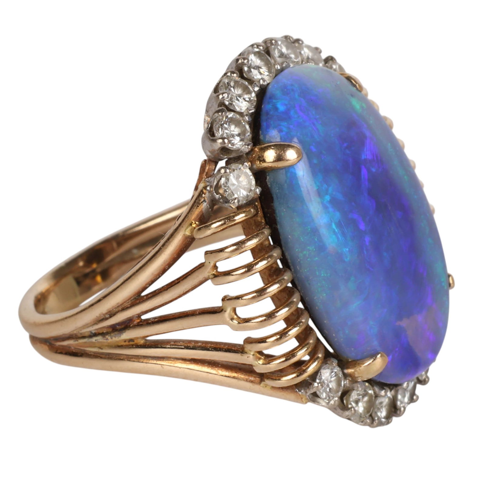 14K Gold Black Boulder Opal and Diamond Ring 10.9g: 14K yellow gold statement ring featuring an oval black boulder opal cabochon measuring approximately 21 x 13.5 mm, estimated at nearly 6 carats. The opal is secured in a prong setting and surrounded b