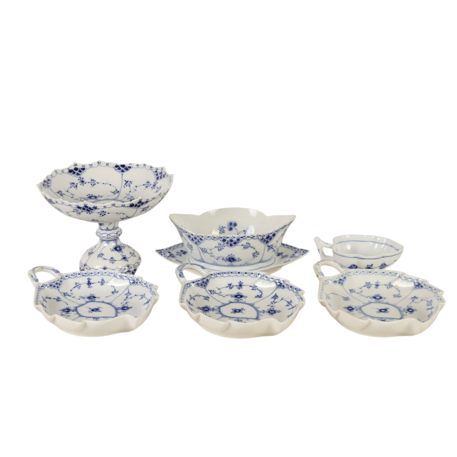 Royal Copenhagen Blue Fluted Half Lace Dish Lot 6p: Royal Copenhagen Denmark, a Blue Fluted Half Lace Border pattern group including a gravy boat with attached underplate, three leaf shaped dishes and a smaller leaf shaped pickle dish, accompanied by a