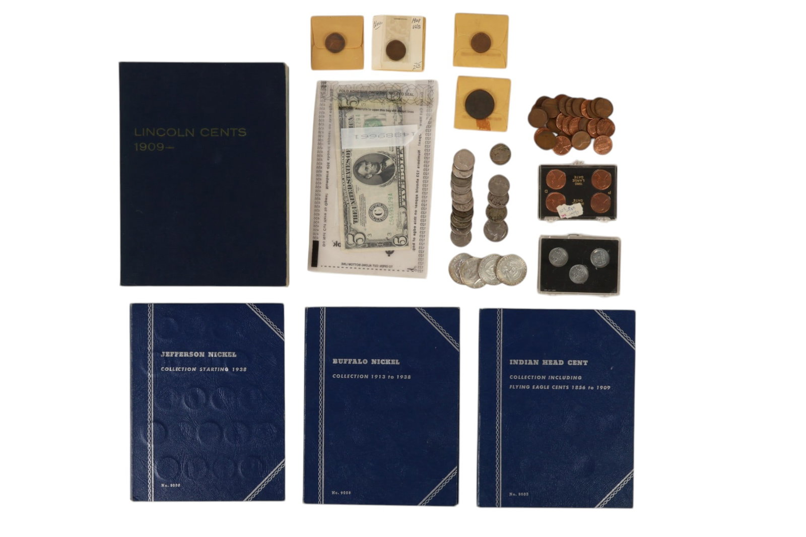 US Coins, Books & Loose Change & Five Dollar LOT: United States coin and currency estate lot comprising four albums and loose examples. Jefferson Nickel folder includes 50 coins. Indian Head Cent folder includes one penny. Buffalo Nickel folder inclu