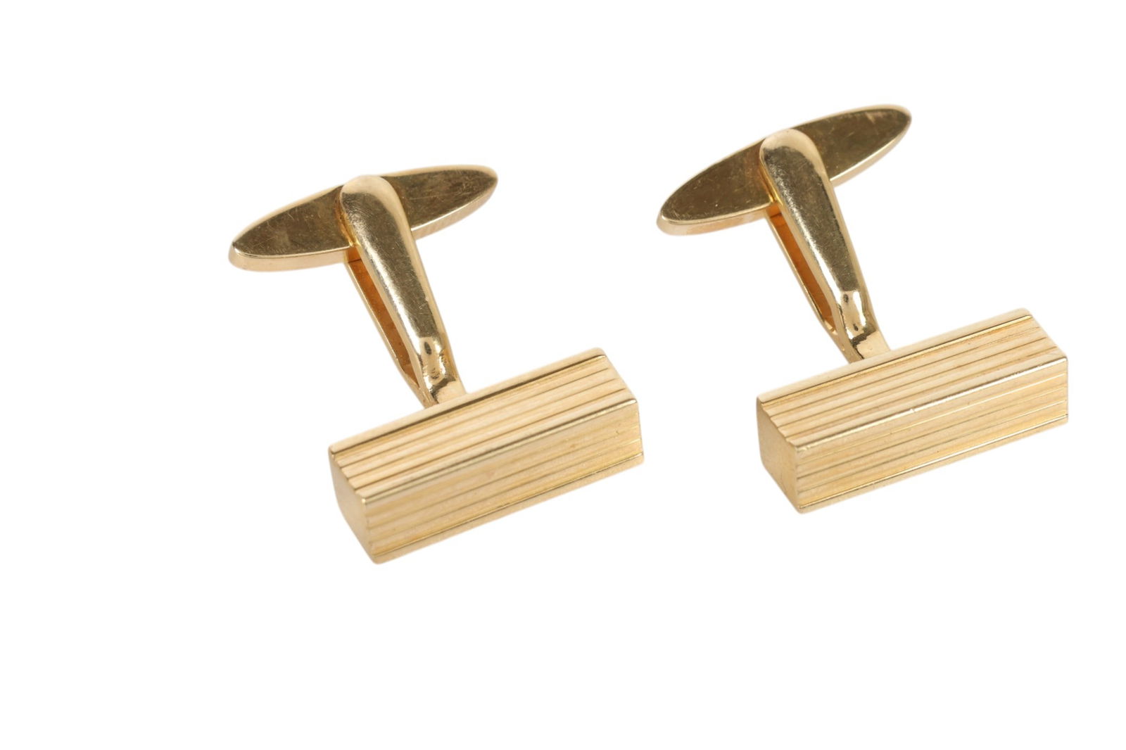 14K Yellow Gold Bar German Grosse 1962 Cufflinks: Grosse, a pair of vintage 14K yellow gold cuff links featuring a clean rectangular form with horizontal ribbed detailing across the face exemplifying classic mid century modern design. Stamped Made in