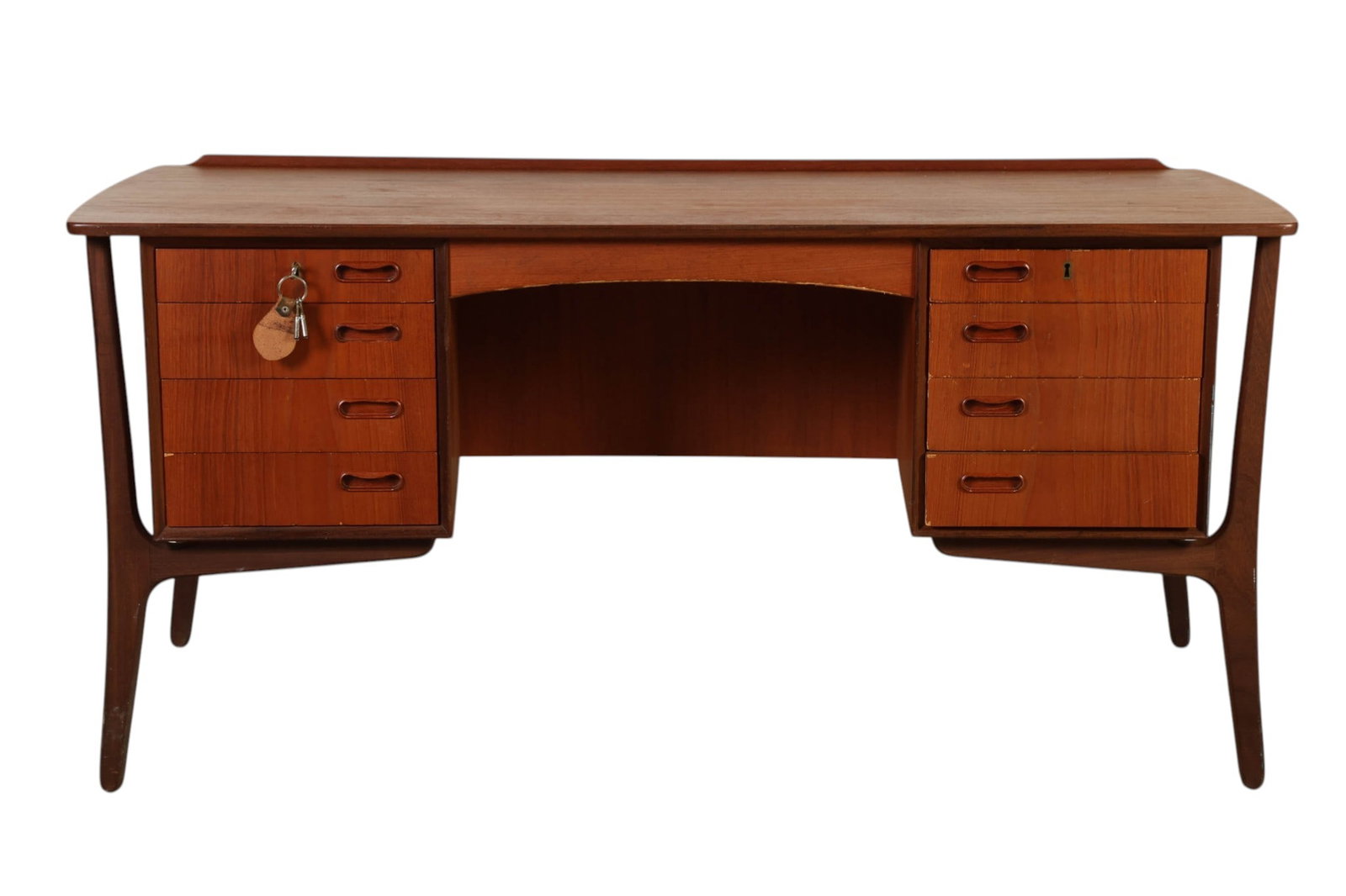 Svend Madsen Danish Modern Walnut Executive Desk: Svend Aage Madsen, a Danish Modern walnut executive desk designed for SAM Furniture circa 1960s, featuring a sculptural form with tapered rosewood legs and a gracefully curved apron. The working side