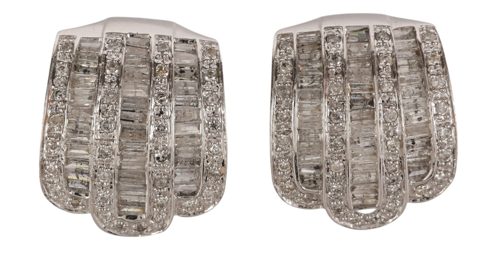 14K White Gold Diamond Art Deco Earrings 8.7g: 14K white gold, a pair of Art Deco diamond earrings featuring alternating rows of baguette cut and round brilliant cut diamonds in a tiered ribbon like design. The diamonds total approximately 1.5 ctt