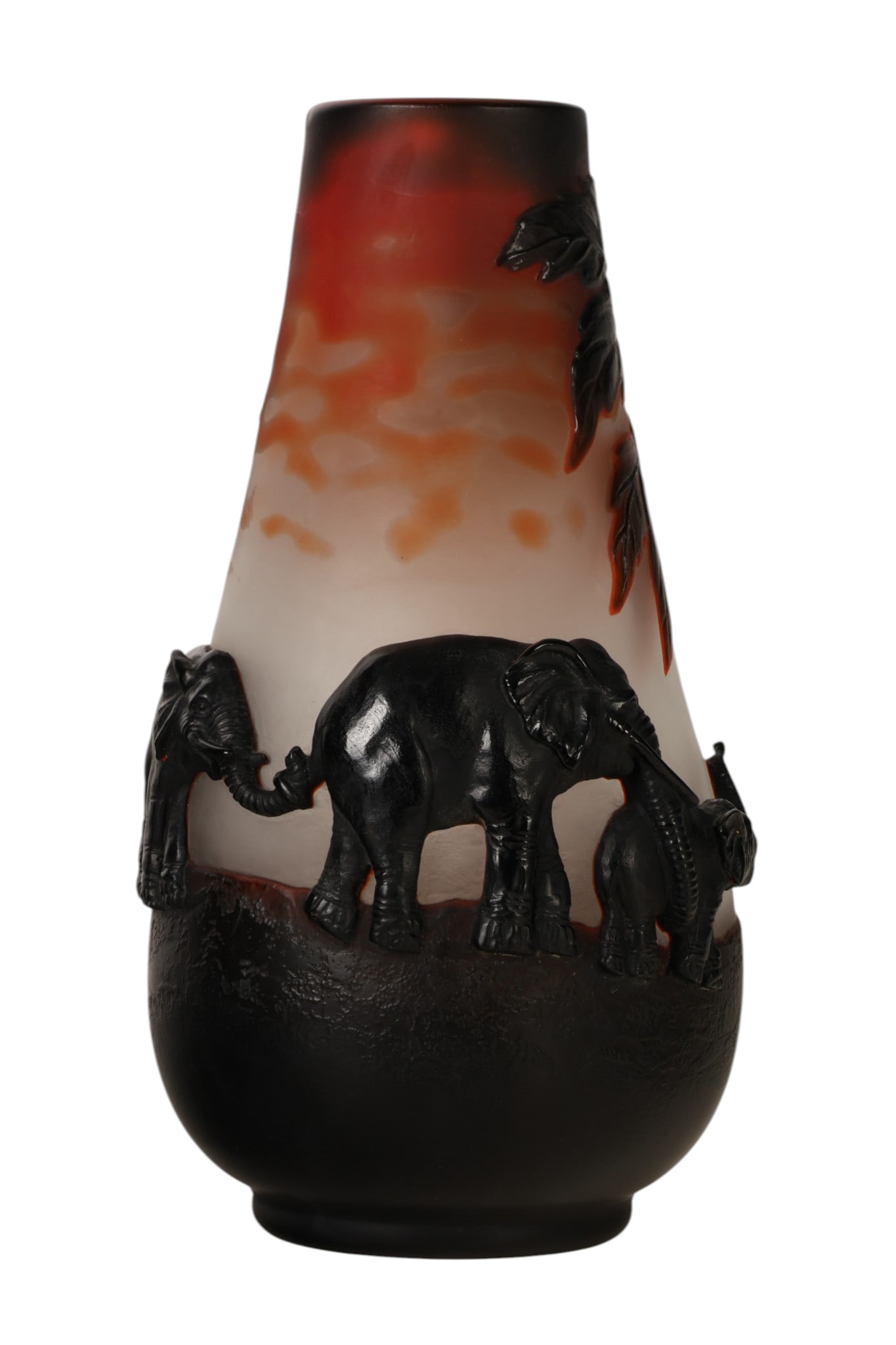 French Cameo Art Glass Elephant Vase after Galle: French cameo art glass vase of tapering cylindrical form decorated with applied and carved elephant figures and foliage against a shaded ground in red, orange, and deep ruby red tones. The layered gla