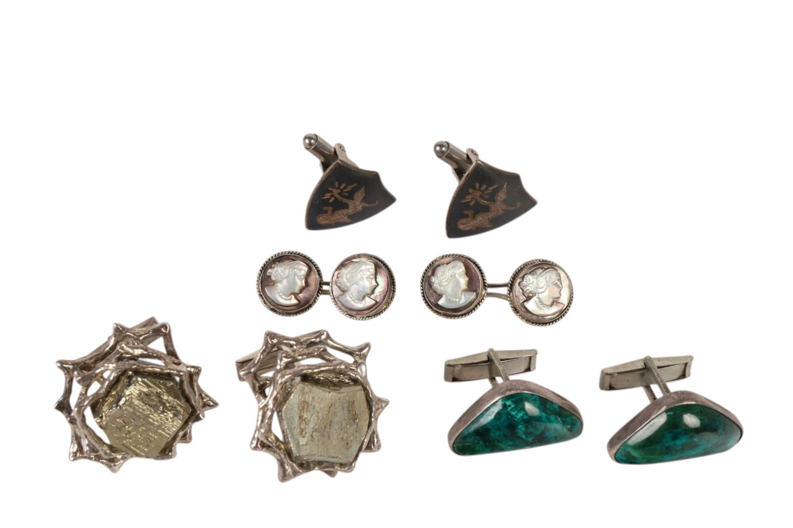 Four Pairs of Vintage Sterling Silver Cufflinks: Sterling silver, a lot of four pairs of vintage cufflinks including one pair marked 935 Israel set with green King Solomon Stone, one pair of Siam sterling cufflinks with etched figural panels, one pa