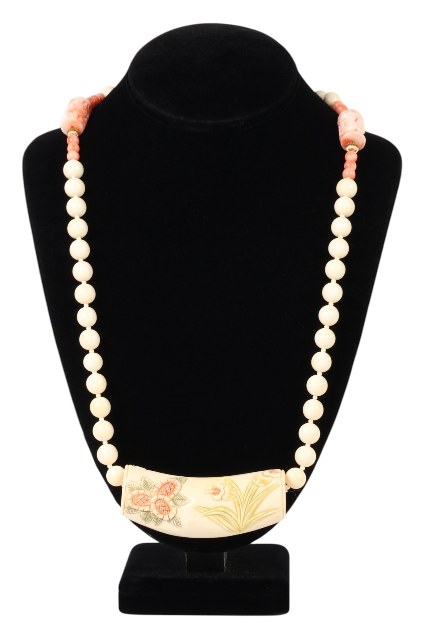 Antique Chinese Bone and Coral Bead 13" Necklace: Antique Chinese bone and coral necklace comprising round bone beads and coral beads with central carved bone sliding pendant depicting floral motif, flanked by two carved coral barrel form elements an