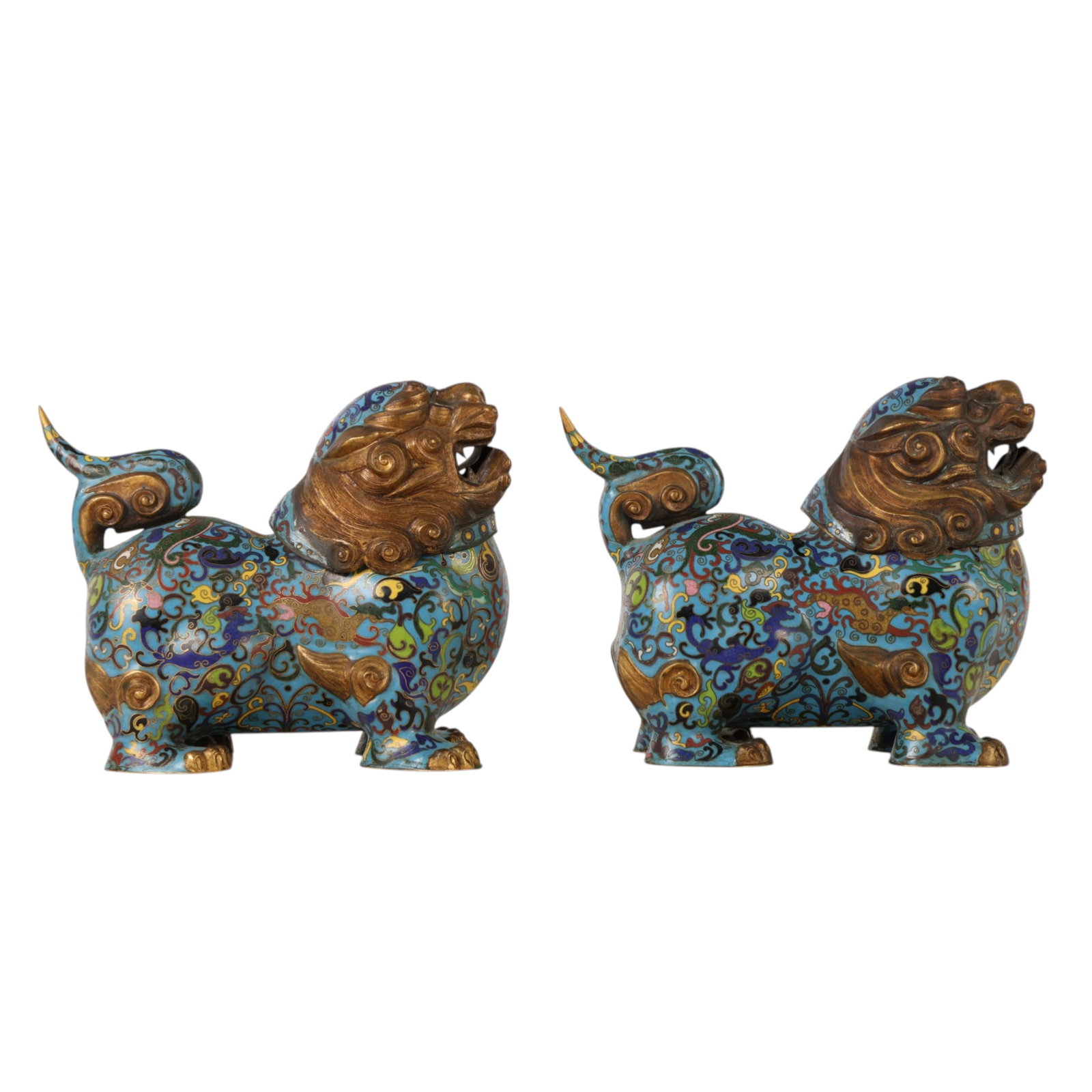 Chinese Pair Cloisonne Enamel Foo Dragon Lion Dogs: Chinese, a pair of covered vessels modeled as foo dogs decorated in cloisonne enamel with scrolling vine motif on a turquoise ground and gilt details to the face, mane, paws and tails. Hollow interior