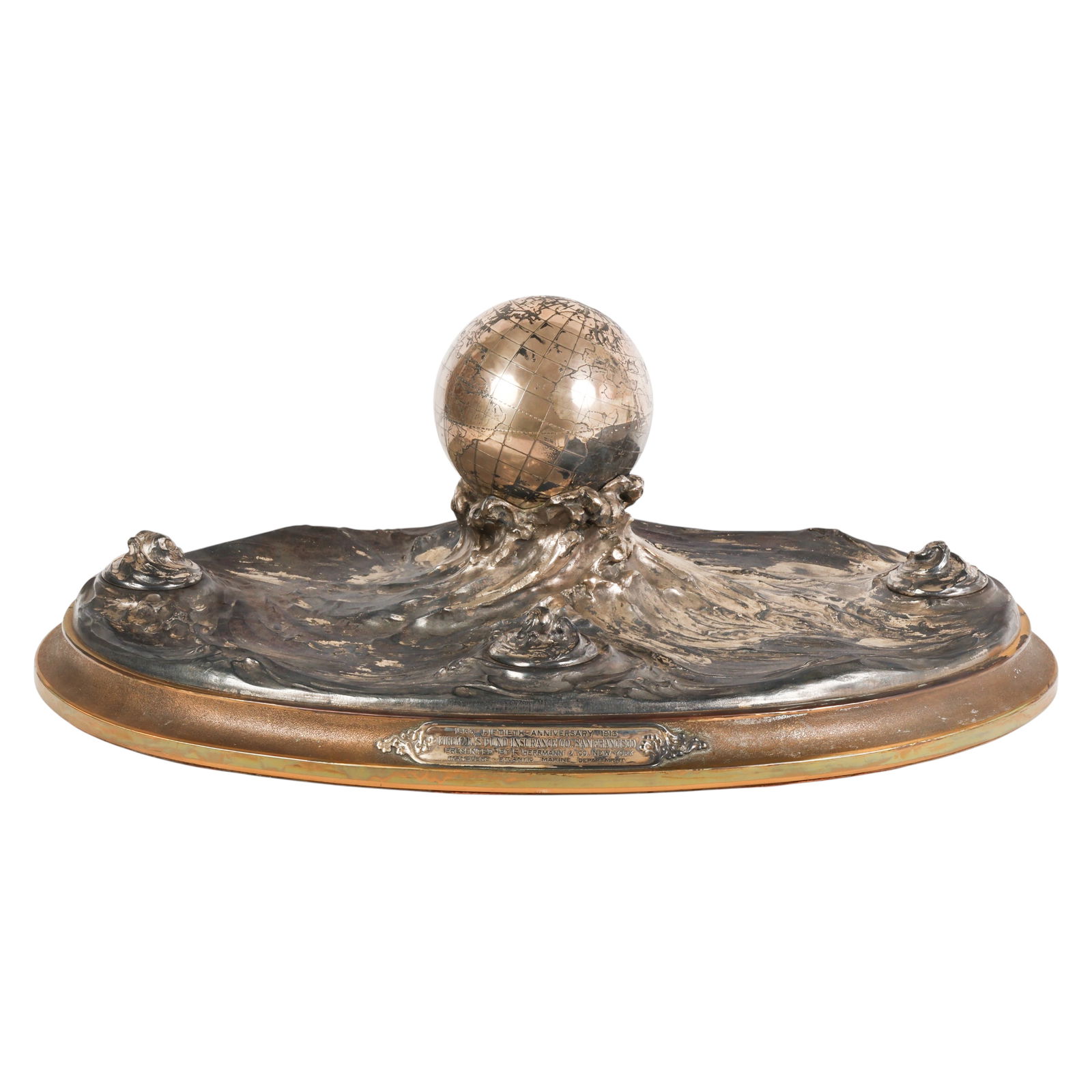 Tiffany & Co Sterling Globe Inkwell Centerpiece: Tiffany and Co, an antique sterling silver sculptural globe inkwell centerpiece featuring dynamic swirling ocean waves supporting a central rotating globe, symbolizing global maritime protection. The