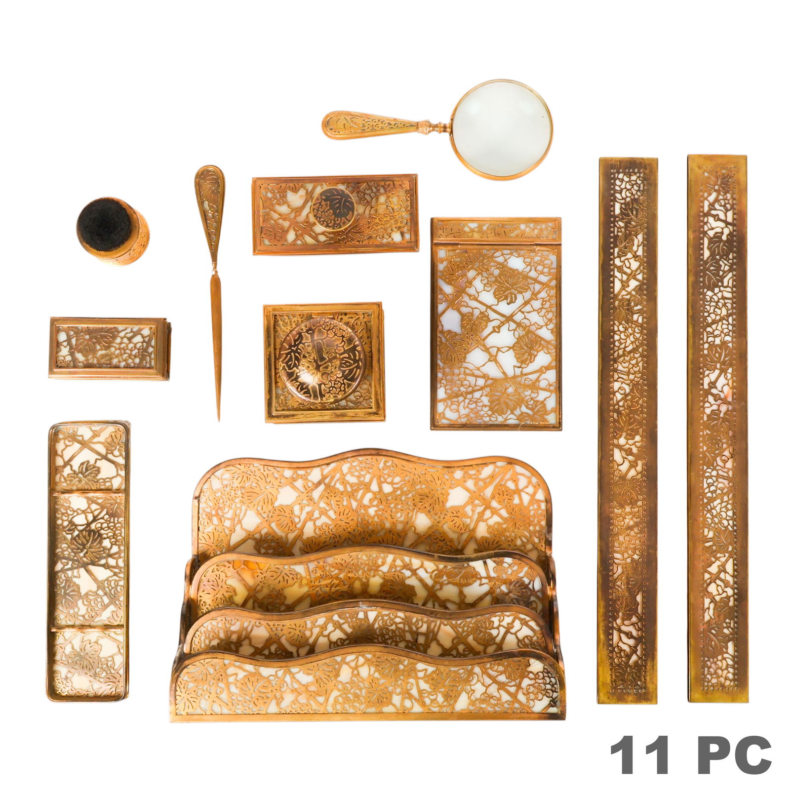 Tiffany Studios New York Grapevine 11pc. Desk SET: Tiffany Studios New York, eleven piece Art Nouveau Arts and Crafts desk set in the gilt Grapevine pattern with ivory opalescent glass panels. The group includes a pair of blotter ends (999), pen brush