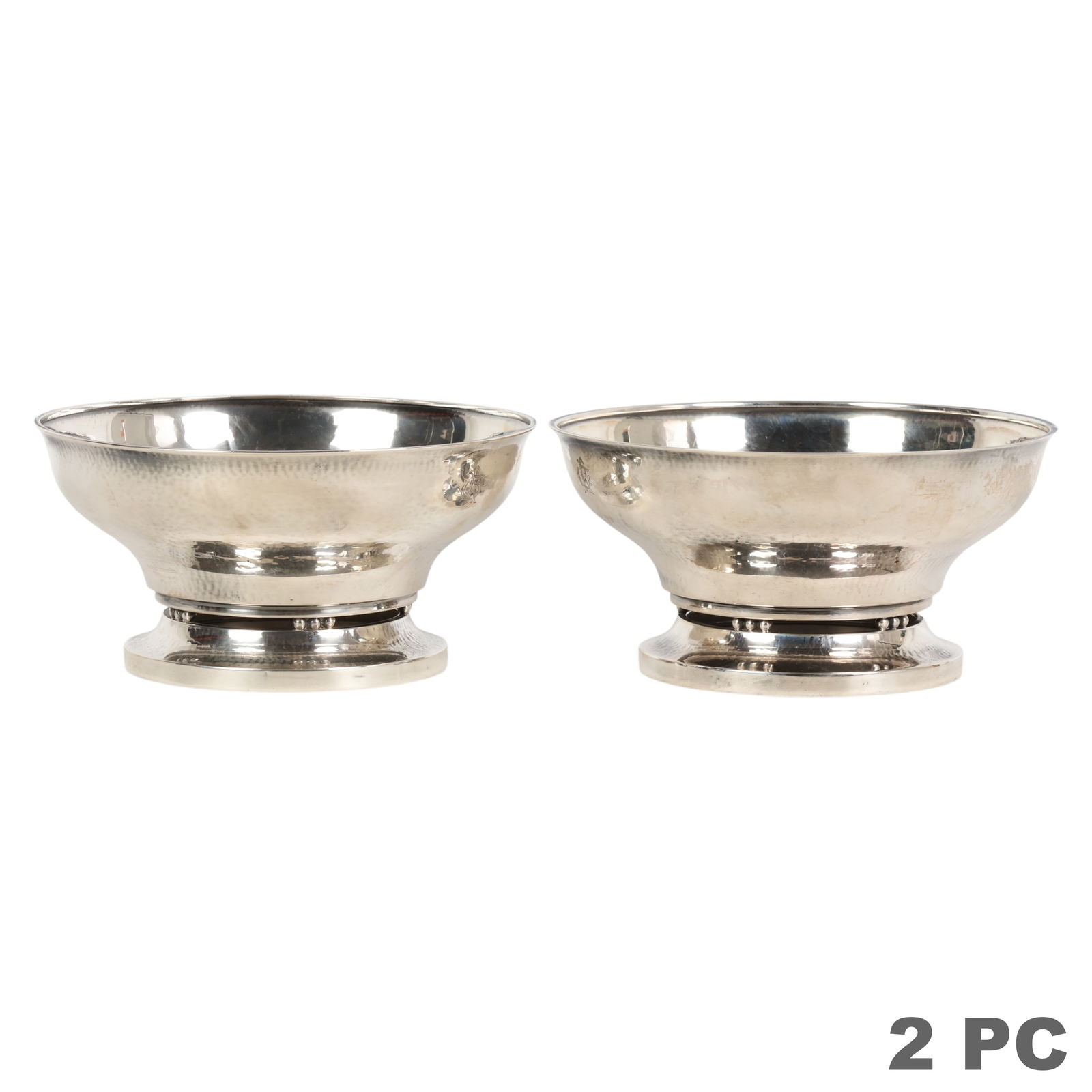Georg Jensen Pair Sterling Silver 414B Bowls 550g.: Georg Jensen, a pair of sterling silver footed bowls featuring a hand hammered surface with gently flared rims and raised foot rings accented by beaded joint detailing, reflecting the refined Scandina