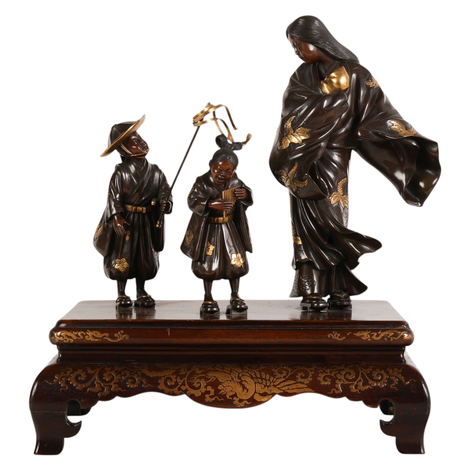 Japanese Miyao Zo Meiji Tokiwa Gozen Bronze Group: Japanese, Meiji period Miyao Zo bronze okimono group depicting Tokiwa Gozen with two attendants, each figure dressed in traditional attire with applied gilt floral decoration. The figures are mounted