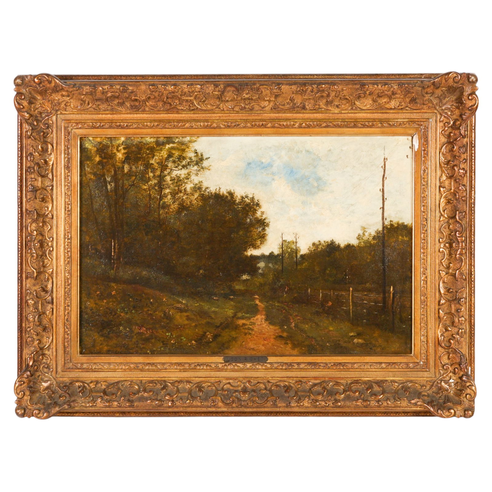 Leon Richet 1847-1907 French Landscape Painting: Leon Richet (French, 1847-1907), an oil on canvas landscape depicting a dirt path bordered by a rustic fence and dense forest beneath a partially clouded sky. The composition reflects Richet's Barbizo