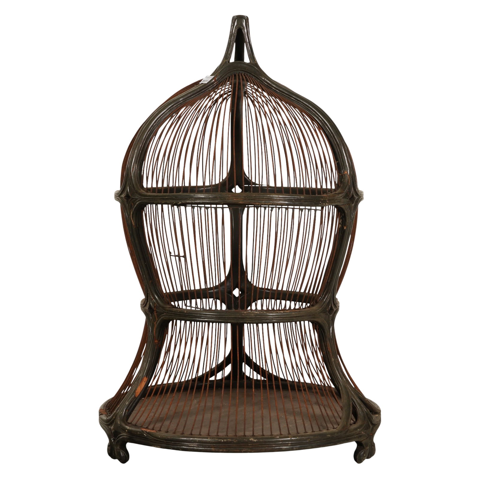 Antique Art Nouveau Dark Carved Wooden Bird Cage: Antique Art Nouveau bird cage constructed with a carved wood framework and metal wire rod enclosure. The design features a domed top with an integrated handle, shaped carved supports, and a circular
