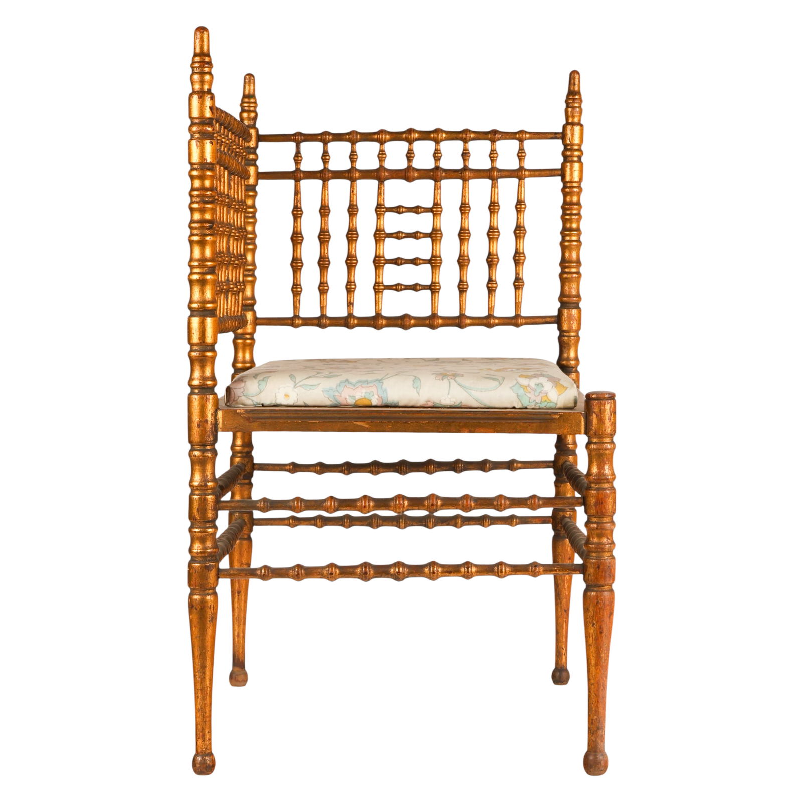 Antique Chinoiserie Gilt Wooden Corner Chair: English, antique Victorian chinoiserie gilt corner chair in the Chinese taste featuring a spindle gallery back forming a right angle corner configuration. Raised on bamboo form gilt legs joined by
