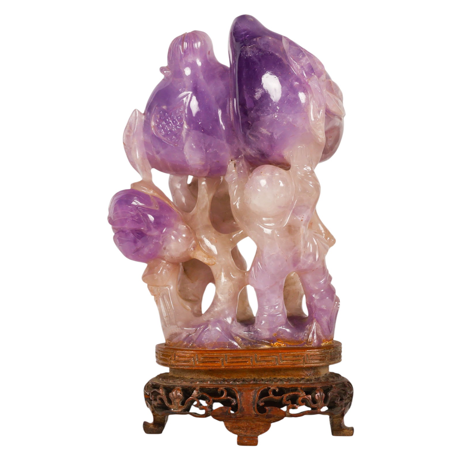 Chinese Carved Amethyst Boys w/ Peaches Sculpture: Chinese amethyst quartz, a carved natural stone figural sculpture depicting two boys holding peaches growing from a gnarled tree, the composition symbolizing longevity and abundance in traditional Chi