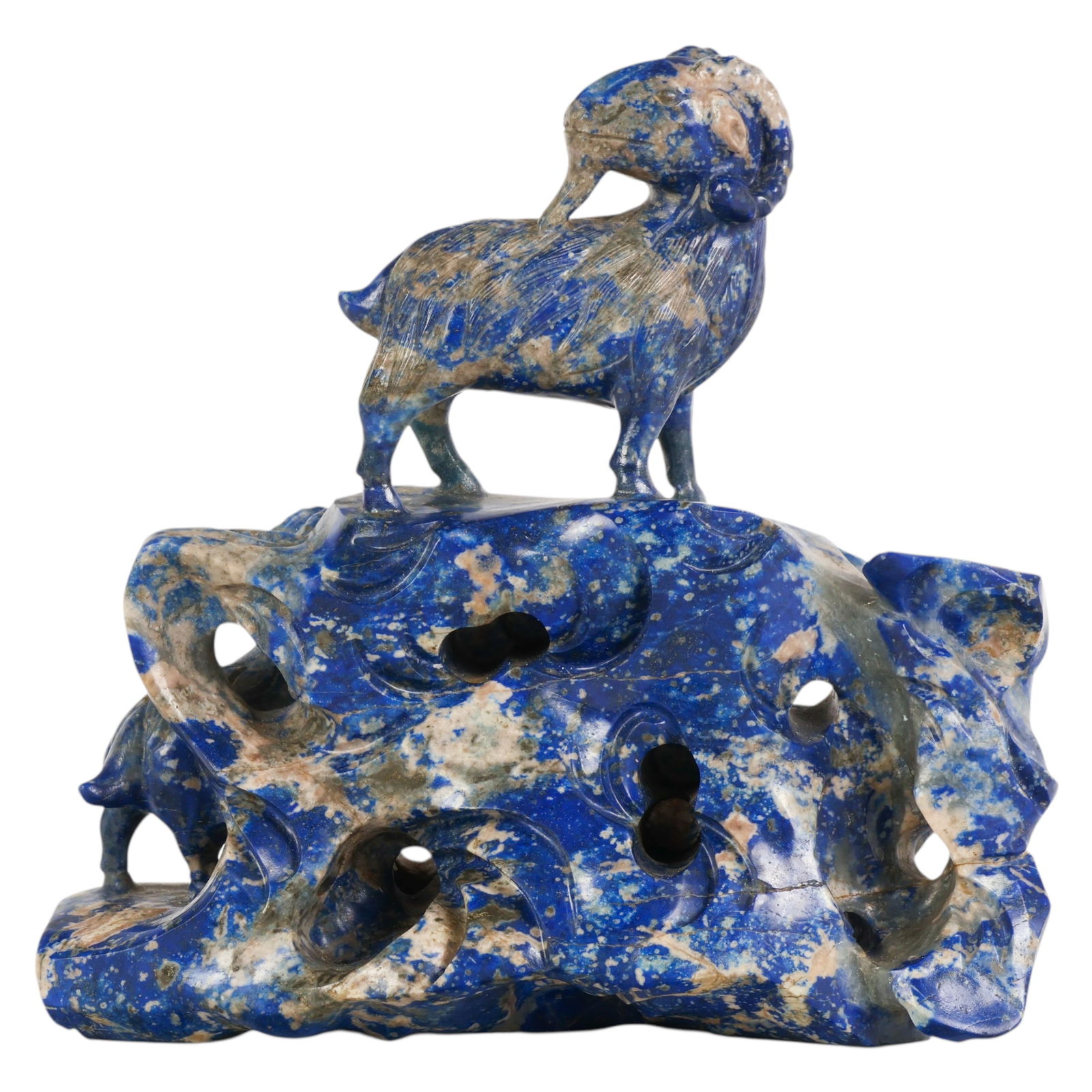 Chinese 17th Century Lapis Lazuli 3 Rams Group: Chinese 17th Century lapis lazuli, a carved natural stone figural group depicting three rams standing and climbing across an irregular rockwork base, the animals modeled with curved horns and detailed
