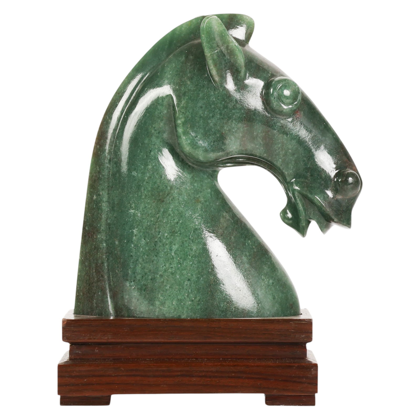 Chinese Carved Green Jade Horse Bust on Base: Chinese green jade, a carved natural stone bust depicting the head of a horse with stylized features including flared nostrils, bulging round eyes, and defined ears and flowing mane, the sculpture emp