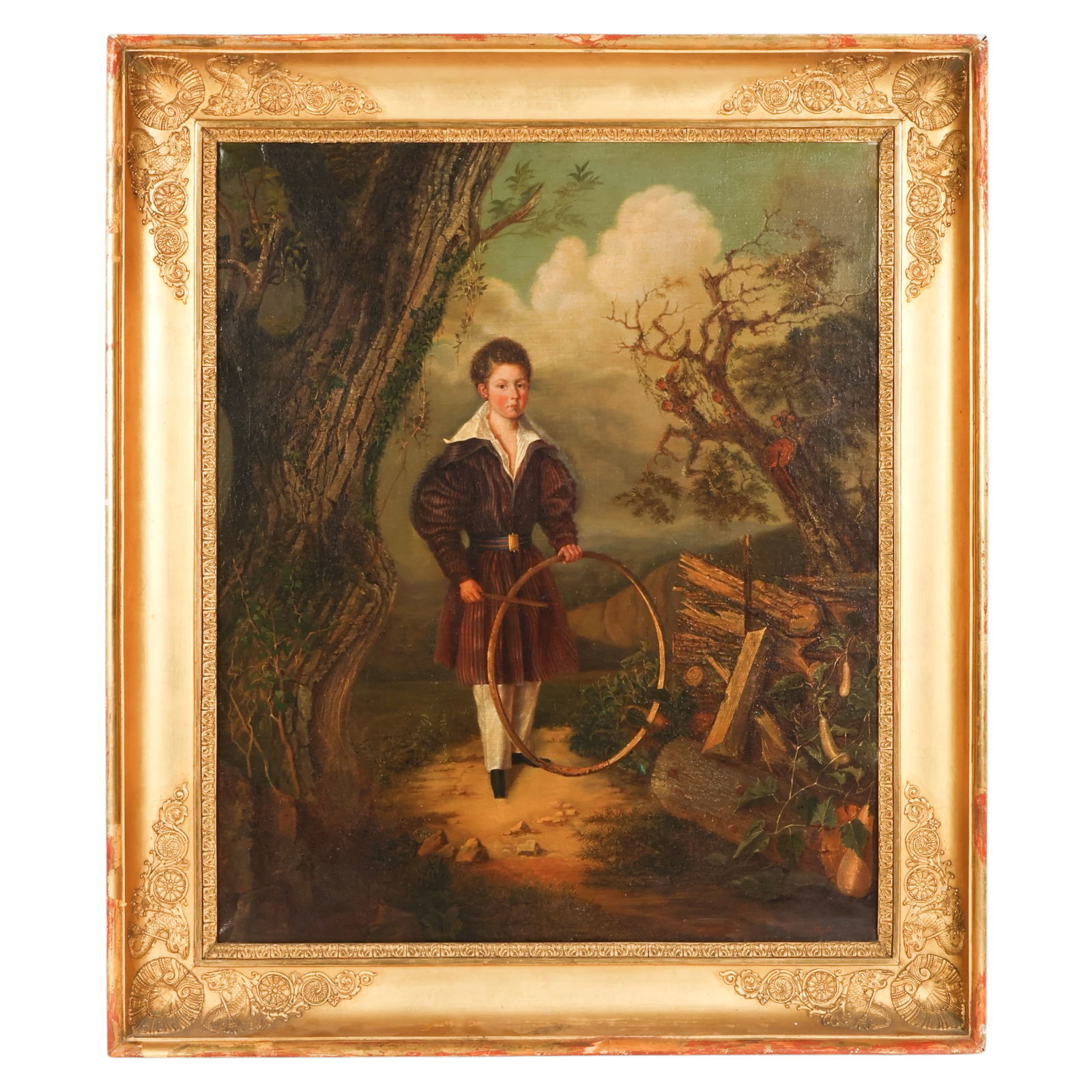 Antique Boy with Hoop Figural Painting Signed: European, an antique oil on canvas depicting a full length portrait of a young boy posed within a verdant landscape, holding a wooden hoop and stick beside a felled tree and axe, with lush foliage for
