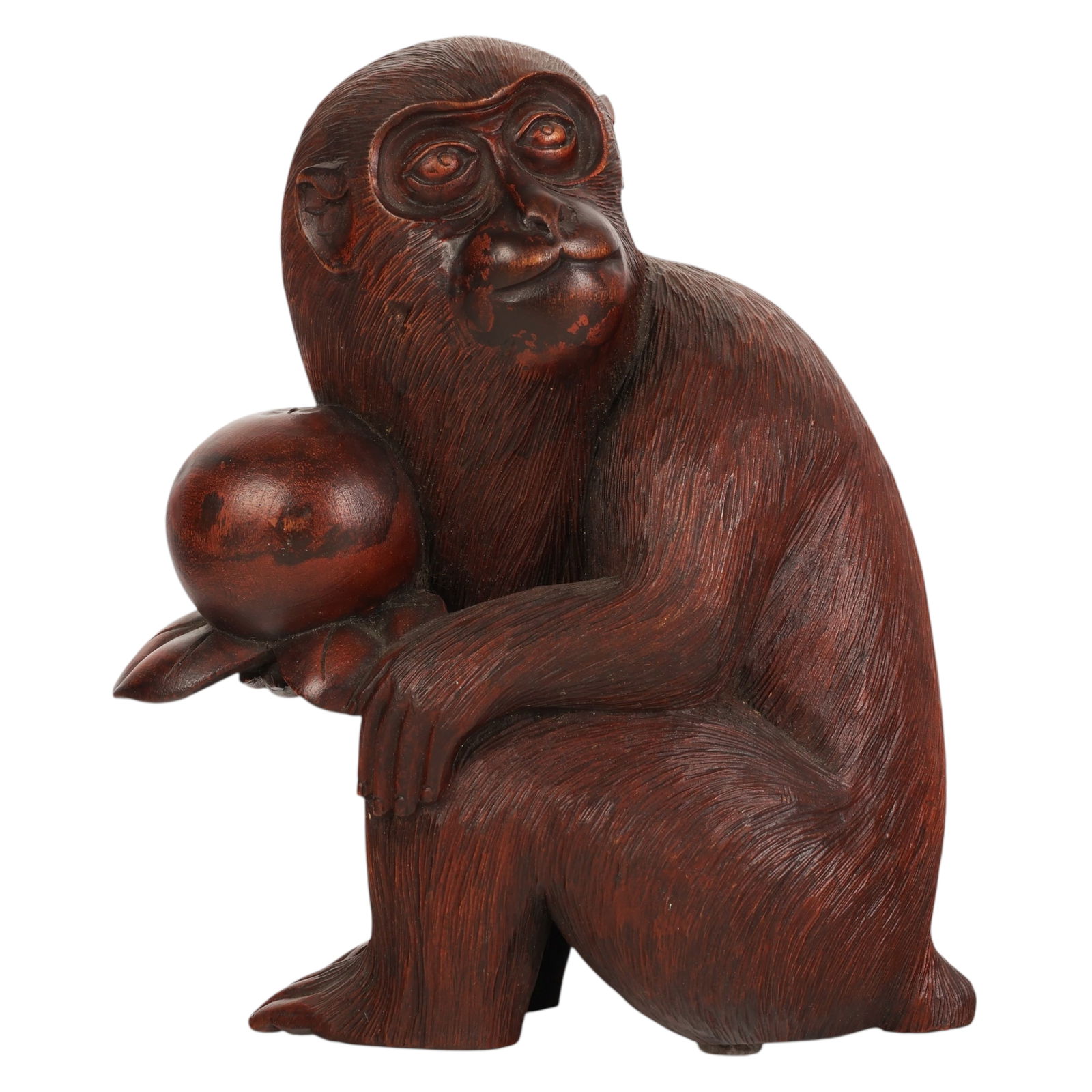 Japanese Meiji Wooden Monkey Sculpture signed: Japanese Meiji period, an antique carved wood sculpture depicting a seated monkey holding a cluster of ripe persimmons. The figure is rendered with finely detailed naturalistic fur texture and express