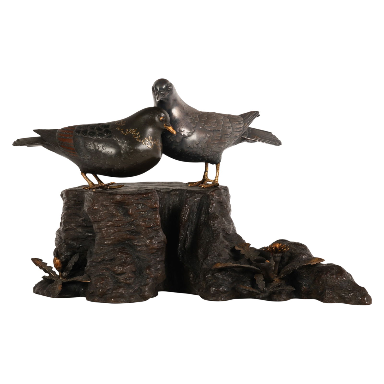 Japanese Silver and Bronze Okimono Birds Signed: Japanese Meiji period signed mixed metal work, an okimono depicting two doves perched upon a naturalistic tree stump with applied plant elements, one dove crafted in bronze and the other in silver, ea