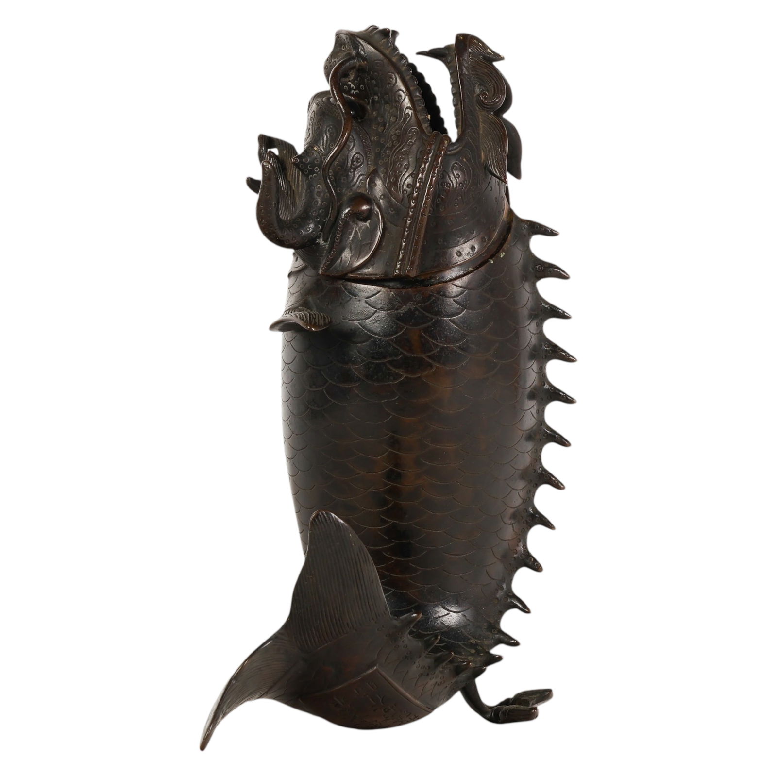 Japanese Bronze Shachihoko Dragon Fish Censer: Japanese, a signed Meiji cast bronze shachihoko censer modeled in the form of a dragon headed fish, the body finely detailed with intricately incised scales and boldly sculpted horns, fins, and curlin