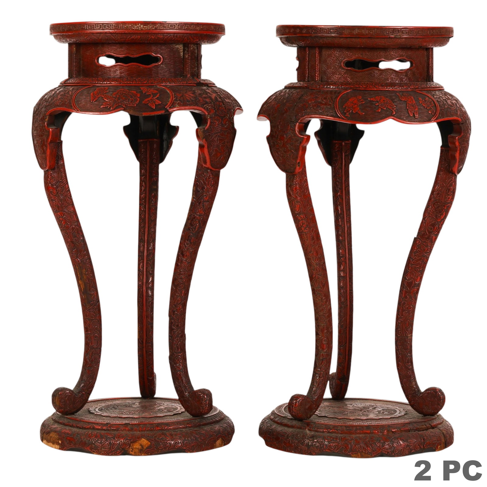 Chinese Pair of Antique Cinnabar Lacquer Stands: Chinese 18th Century pair of antique carved cinnabar lacquer stands featuring detailed relief decoration of floral and figural motifs set against intricately patterned geometric grounds. Each stand is