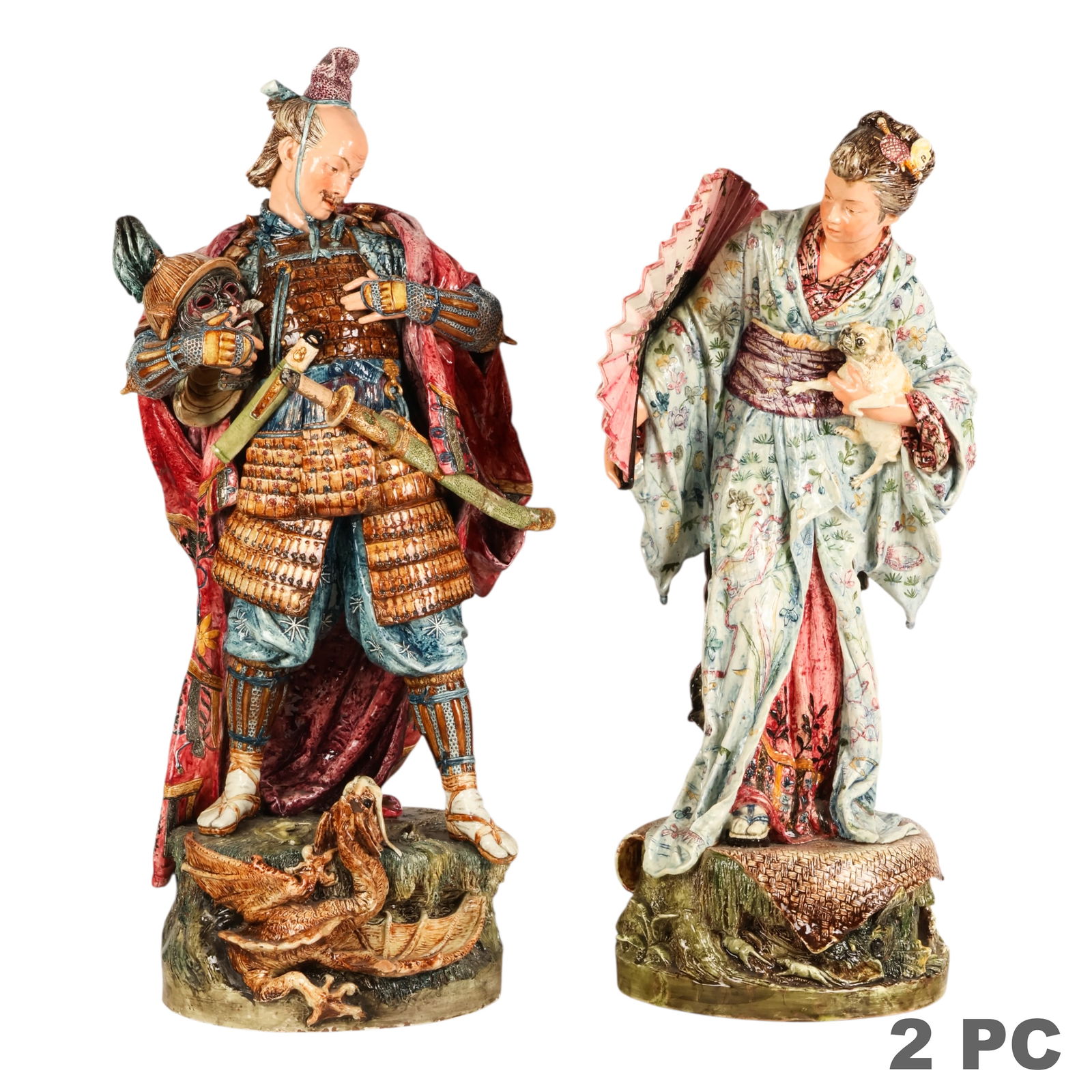 Pair of 19C German Chinoiserie Majolica Sculptures: German, circa 1890, a pair of large Majolica Chinoiserie figures depicting a samurai warrior holding a helmet and a female figure holding a parasol and dog, each mounted on a molded base with relief e
