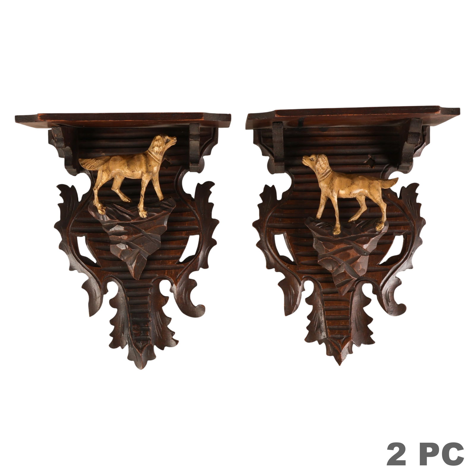 Black Forest Carved Wood Gilt Dog Bracket Shelves: German Black Forest, pair of carved wooden wall hanging shelves featuring foliate and geometric backplates centered by gilt terrier dog figures in relief. Executed with deep carving and layered