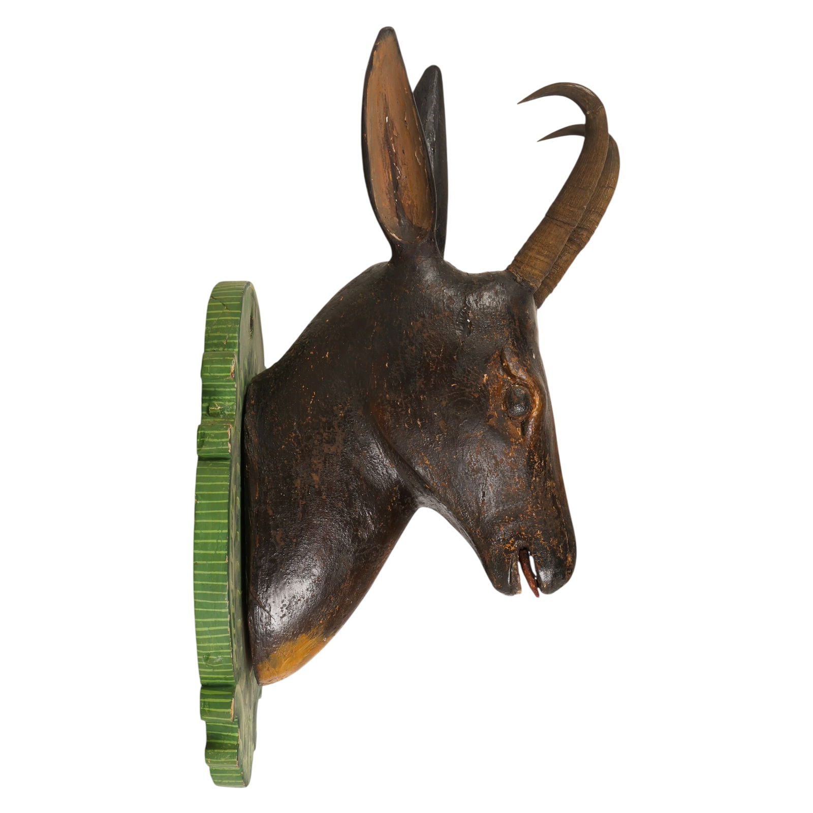 Black Forest Antique Carved Wood Deer Head Trophy: German Black Forest, an antique finely carved wood blackbuck antelope style deer head trophy mounted on a painted backing board. The sculpture features realistically rendered facial detailing and two