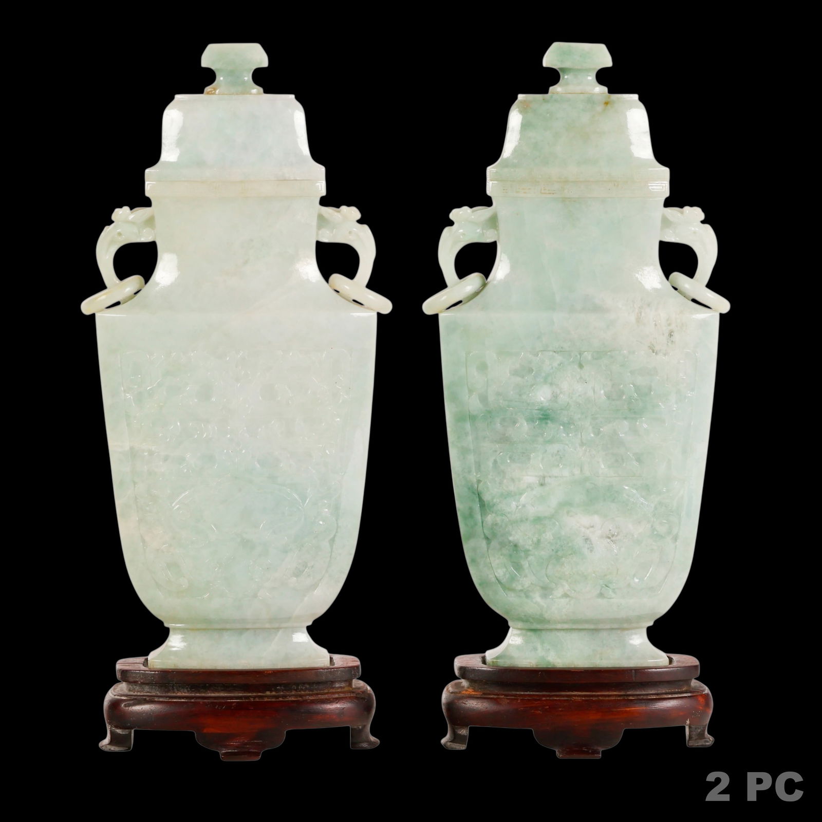 Chinese Pair Archaistic Lavander Jadeite Vases: Chinese Lavander jadeite, a pair of antique carved covered vases of archaistic baluster form with gently tapered bodies rising to waisted necks and fitted domed covers, the stone displaying natural mo