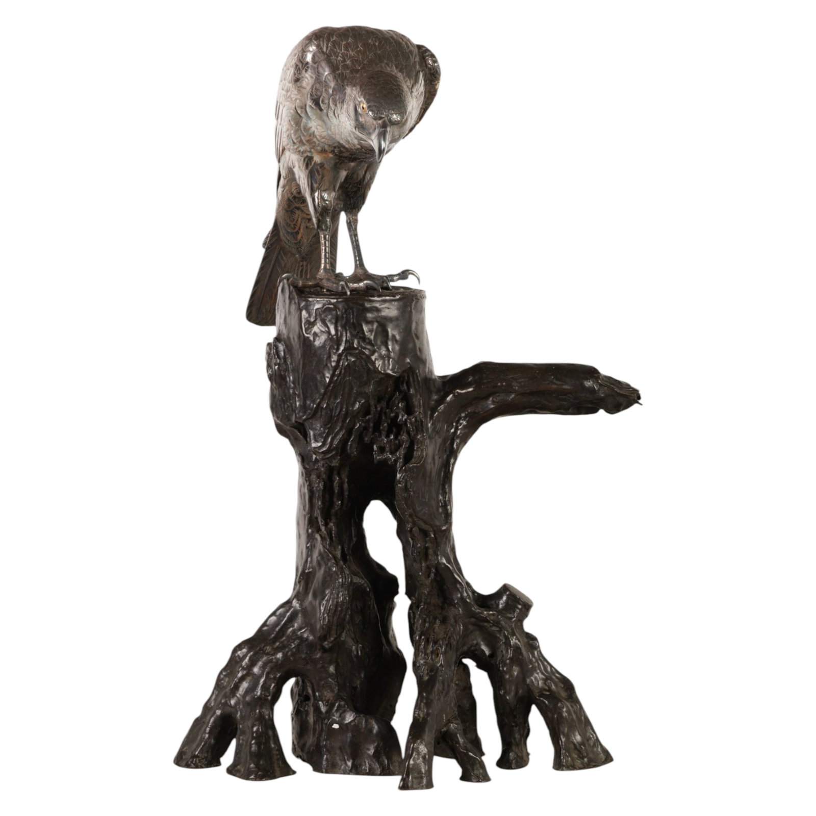 Genryusai Seiya Meiji Silvered Bronze Hawk Statue: Genryusai Seiya (Japanese, 1868-1912), a Meiji period silvered bronze sculpture depicting an eagle type bird of prey perched atop a naturalistically modeled patinated bronze tree trunk base. The bird