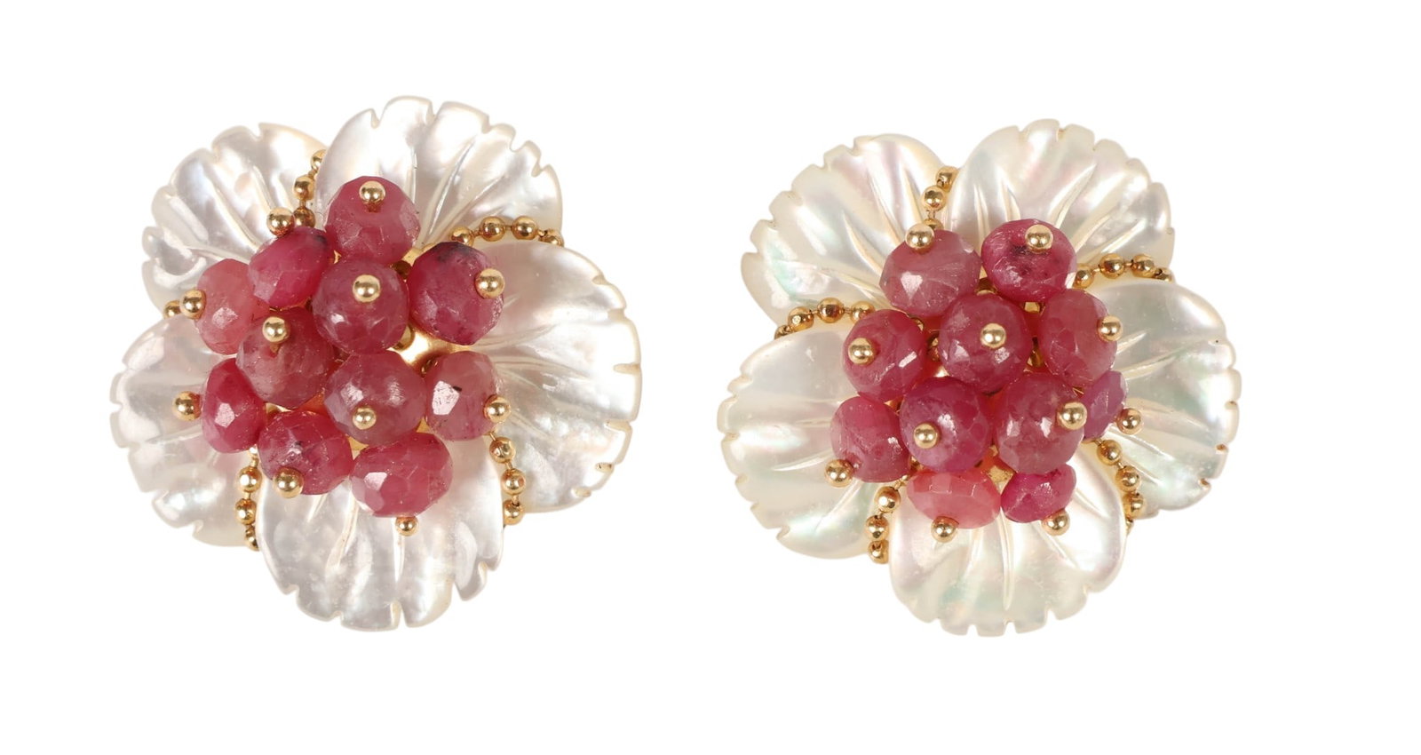 14k Gold Mother of Pearl and Ruby Floral Earrings: 14k gold pair of clip on earrings featuring a floral design set with carved mother of pearl and ruby gemstones. Each earring is formed as a flower with carved mother of pearl petals accented by gold b