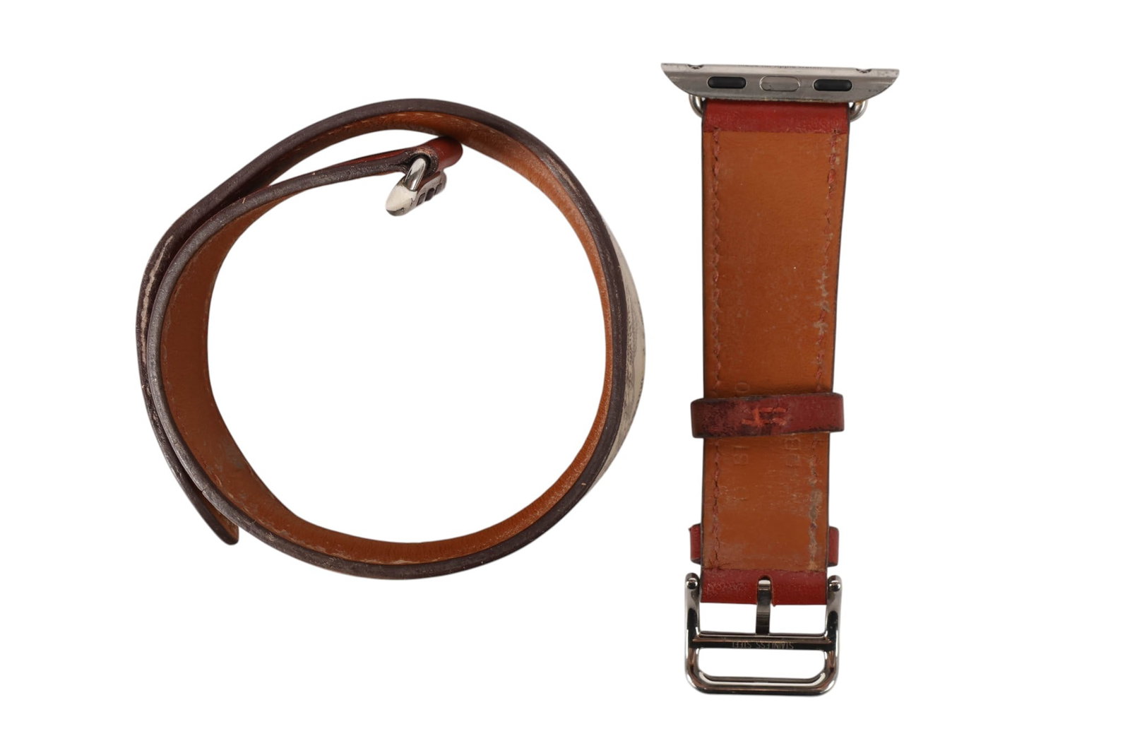 Hermes Apple Watch Leather Double Tour Style Band: Hermes leather Apple Watch band in a double tour wrap style, featuring a brown leather exterior with a cream interior printed with the brands signature chain motif. Designed to wrap twice around the w