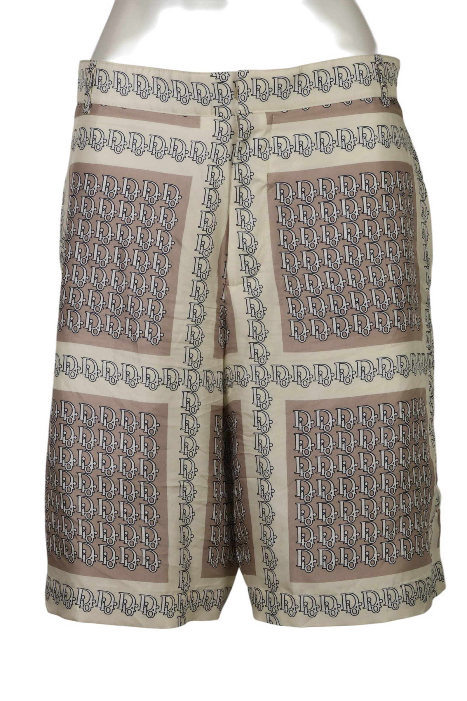 Christian Dior Men's Silk Monogram Shorts Size 48: Christian Dior silk shorts featuring an allover Dior monogram pattern in cream and brown tones arranged in geometric panel blocks. Crafted in lightweight silk, the shorts feature a front zip and butto