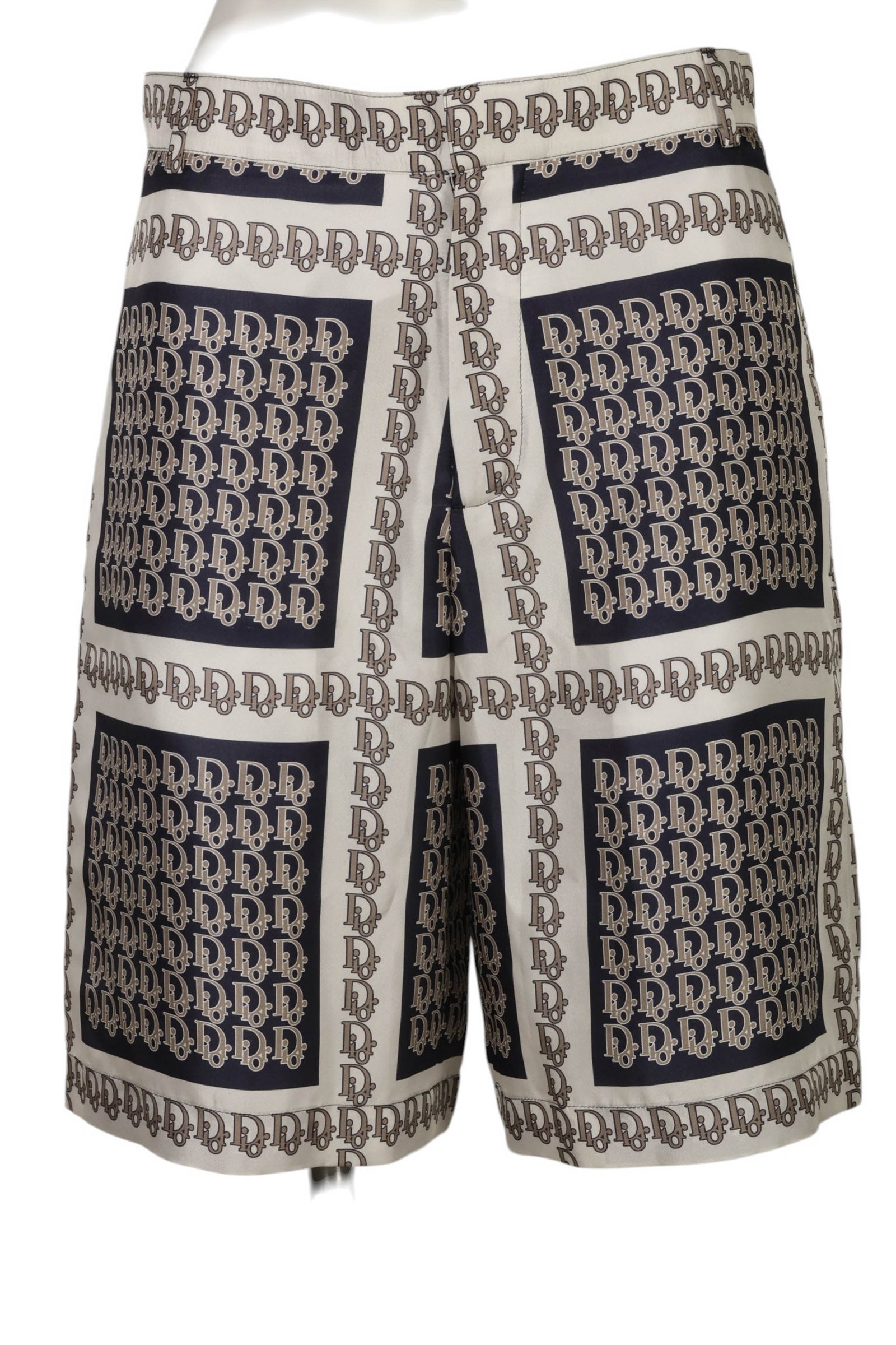 Christian Dior Men's Silk Monogram Shorts Size 48: Christian Dior cream and navy silk shorts featuring an allover Dior monogram pattern arranged in geometric panel blocks that create a bold graphic presentation. Crafted from 100 percent silk the short