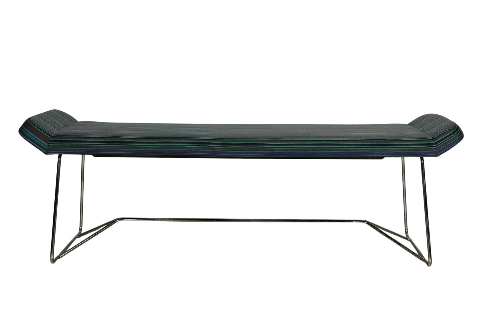 Design Within Reach Blue Upholstered Studio Bench: Design Within Reach upholstered "Studio Bench" featuring a long rectangular cushion with striped textile in blue, teal, and purple tones, raised on a chrome metal base with geometric supports. The und