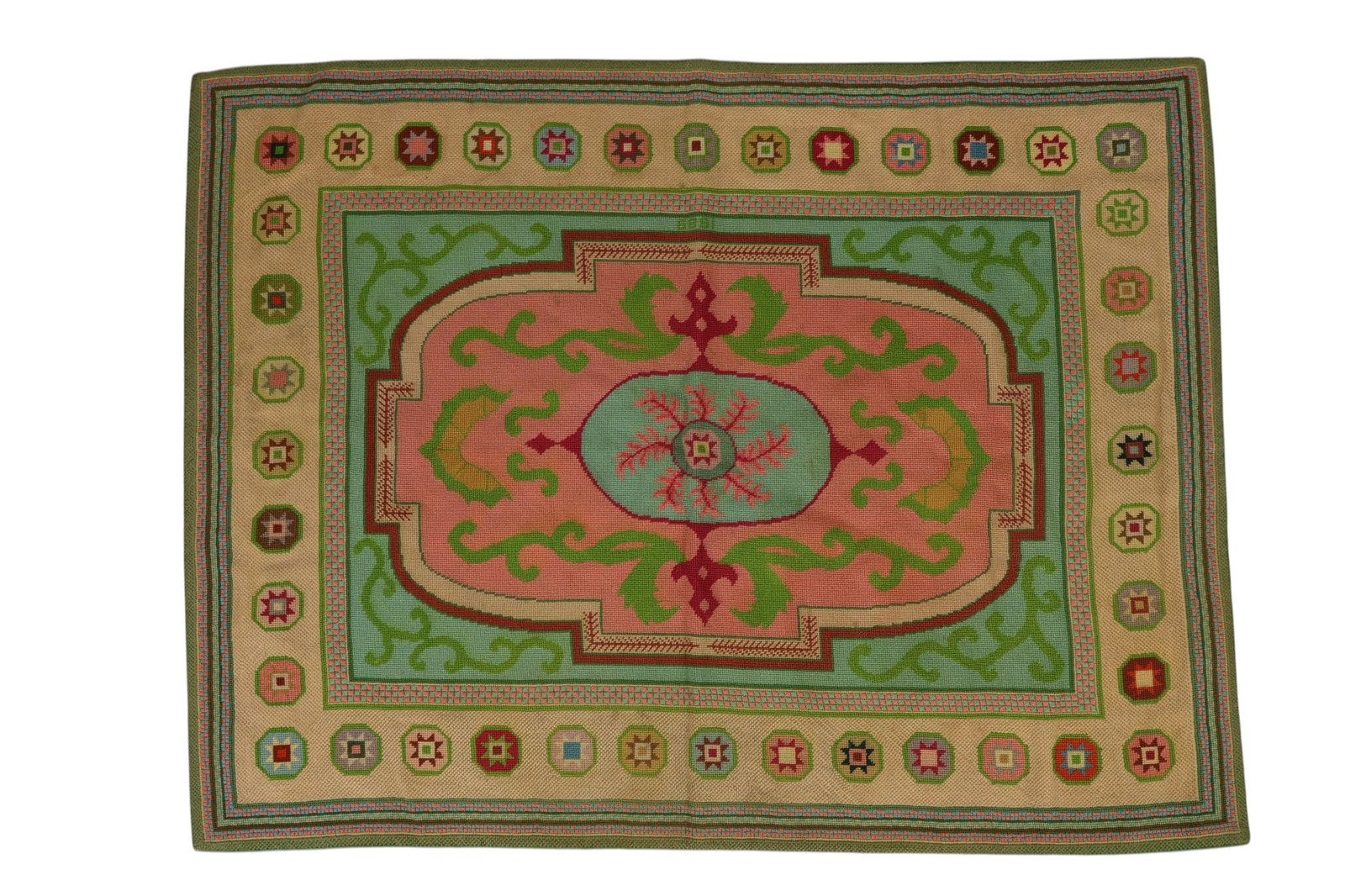Needlepoint Embroidered Floral Geometric Area Rug: Decorative rug featuring a central oval medallion with branching leaf motifs set within a pink field, framed by scrolling green vine forms and geometric elements. Surrounding panels in blue-green tone