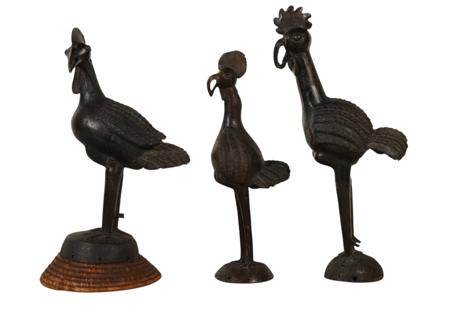 African Yoruba Tribe Style Bronze Chickens 3pc LOT: Lot of three Yoruba Tribe style bronze chicken sculptures, executed in a stylized West African folk art tradition. Each figure features elongated legs, rounded bodies, and expressive, exaggerated head