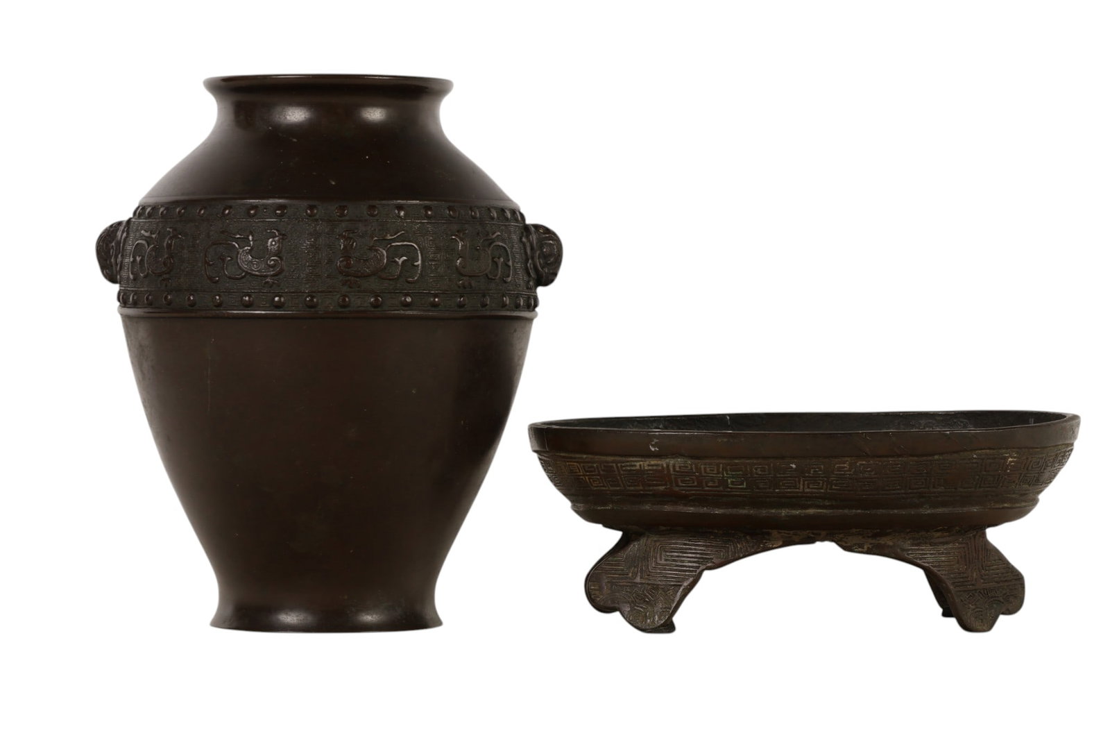 Chinese Bronze Vessel Vase & Oval Footed Bowl LOT: Lot of two Chinese items including a bronze baluster form vase with flared rim and a relief band displaying taotie style masks and geometric motifs and an oval bowl raised on four legs with repeating